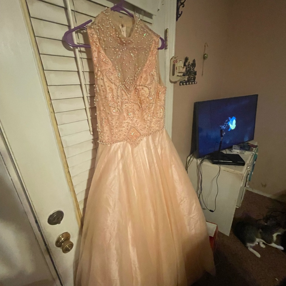 Peach beaded prom dress never worn brand new.